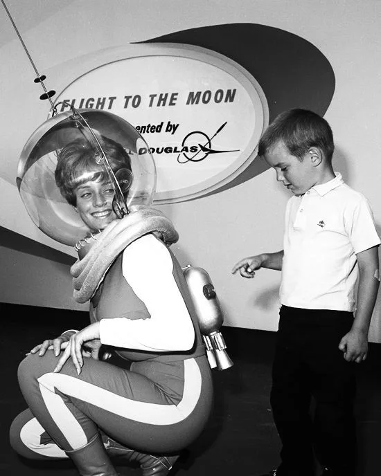 Flight to the Moon. Presented by McDonnell Douglas. Girl in Phantasy Space Suit.