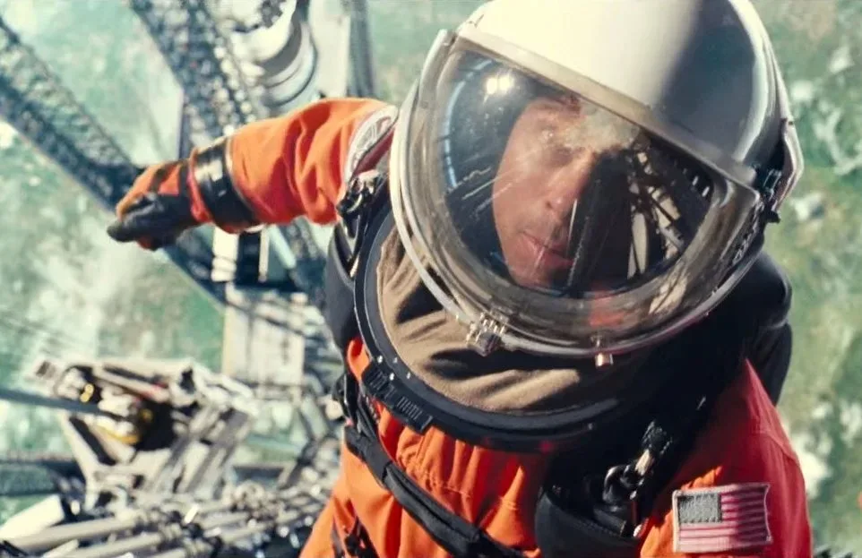 Brad Pitt boards a space elevator in a spacesuit in the movie Ad Astra.